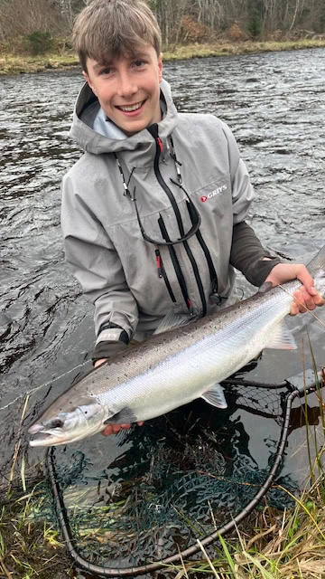 Freddie holding an April spring salmon caught on the River Findhorn at Darnaway, guided by Ian Neale The Speycaster